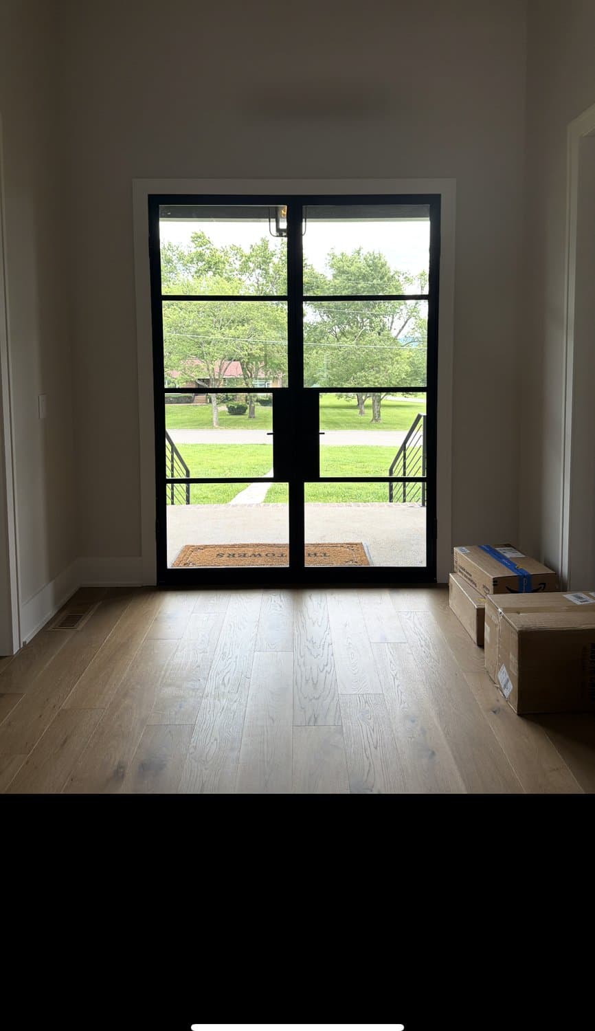 Interior glass entry doors before and after frosted privacy film — before