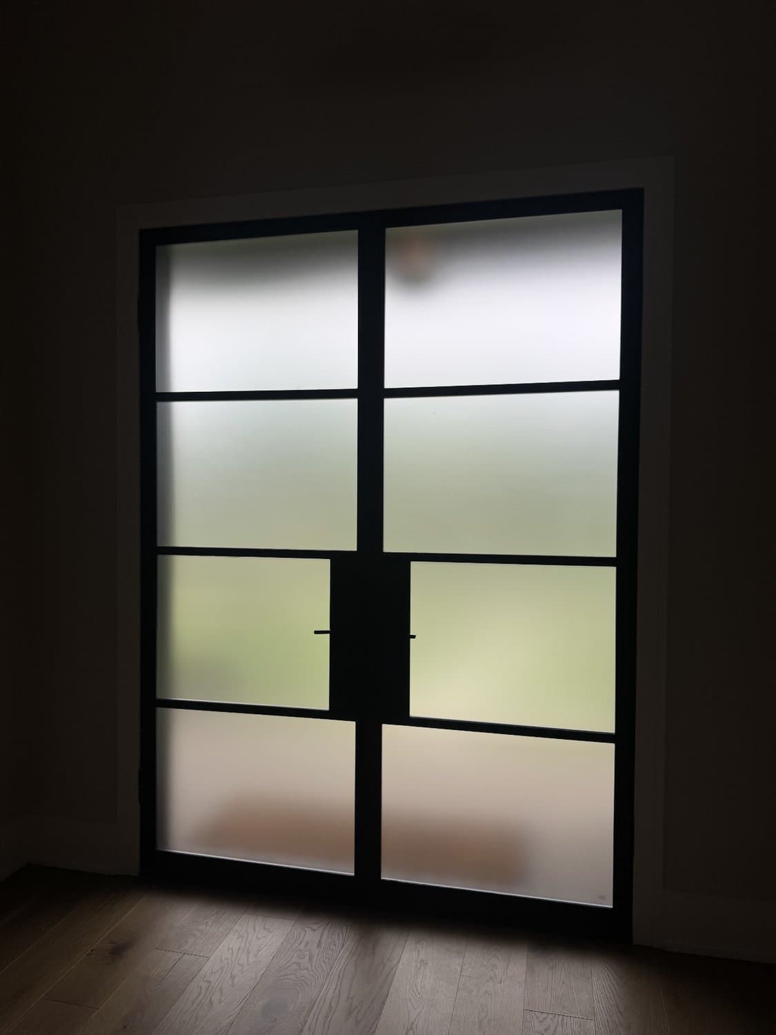 Interior glass entry doors before and after frosted privacy film — after